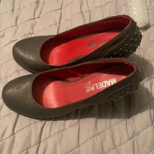 Grey stiletto heels with rhinestone accents